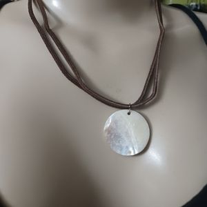Womens leather strand necklace with round shell pendant